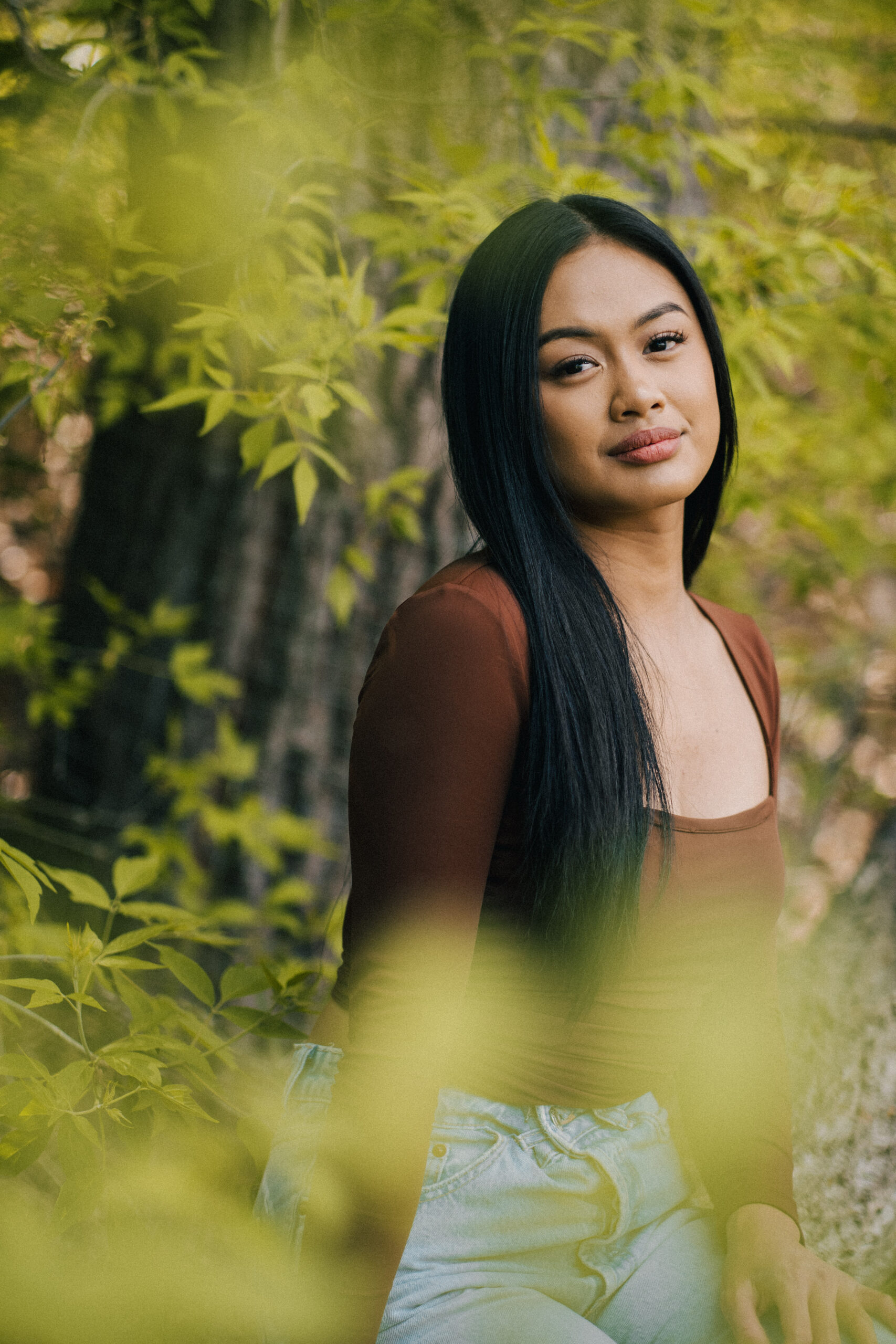 Portrait of a woman sitting among the trees